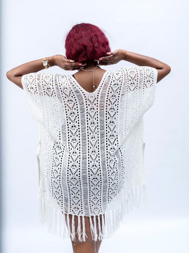 White crochet swim cover up for women with fringe detailing over swimsuit