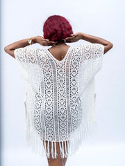 White crochet swim cover up for women with fringe detailing over swimsuit
